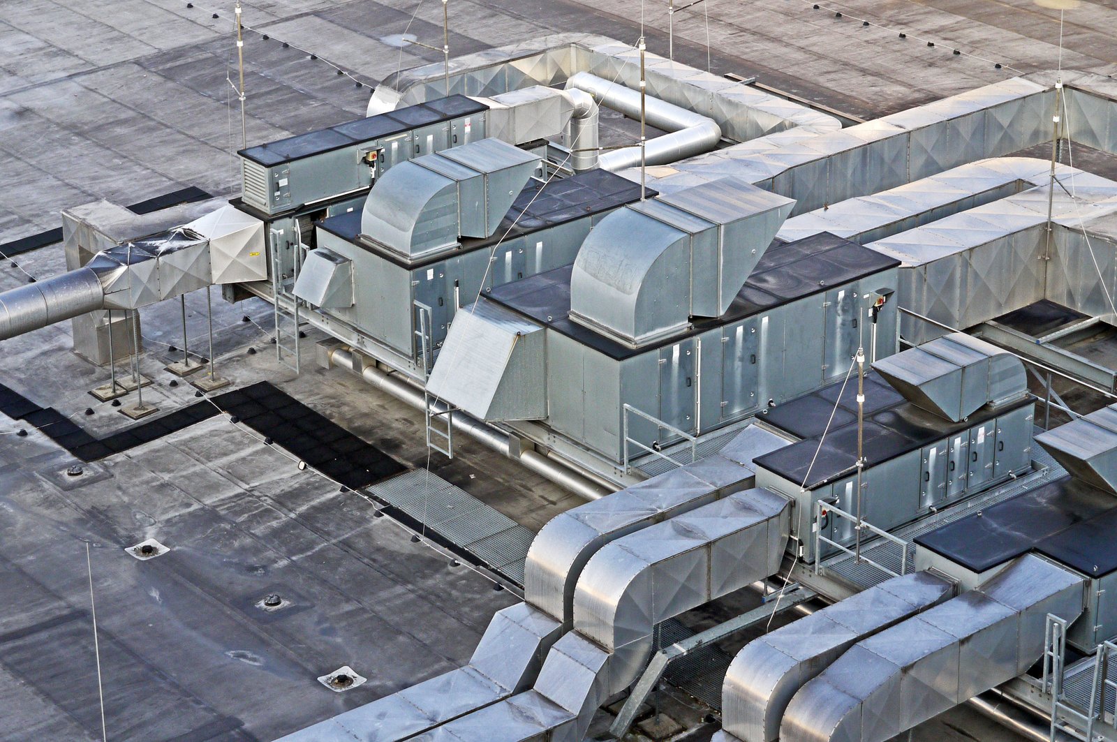 Professional rooftop ducting installation and HVAC unit layout on a building roof